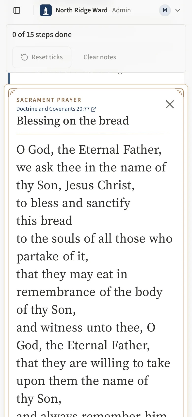 The sacrament prayer card on a phone: the scripture reference, Blessing on the bread with the X to close, and the prayer in large type, one phrase per line.